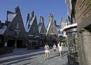 Visitors stroll the streets of The Wizarding World of Harry Potter at Universal Orlando theme park in Orlando, Fla.