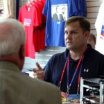 3a-CONVENTION-AUG30_web Brian Harlin, owner of the Glen Burnie-based GOP Shoppe, assists a Republican National Convention delegate at the Tampa Bay Times Forum in Tampa.