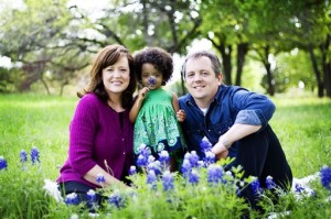 This 2010 picture shows David McDurham, right, his wife, Amy, and their adopted daughter, Ella, in Arlington, Texas. As problems and policy changes reduce the number of international adoptions by Americans, one country--Ethiopia--is emphatically bucking the trend, sending record numbers of children to the U.S. while winning praise for improving orphans' prospects at home.