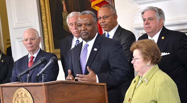 Maryland officials say they are determined to land the FBI headquarters relocation. At Monday's news conference are, from left, Sen. Ben Cardin, Prince George's County Executive Rushern Baker III at podium, Lt. Gov. Boyd Rutherford, Gov. Larry Hogan and Sen. Barbara Mikulski. (The Daily Record / Bryan P. Sears)