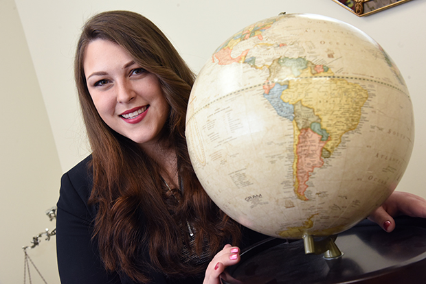 02.03.17 Towson, MD- Portrait of Nicole Whitaker, attorney, in her office with a globe displaying south America. MF
