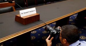 A photojournalist photographs a name placard for former White House Counsel Don McGahn, who is not expected to appear before a House Judiciary Committee hearing, Tuesday, May 21, 2019, on Capitol Hill in Washington. (AP Photo/Patrick Semansky)