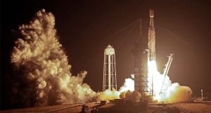 A SpaceX Falcon heavy rocket lifts off from pad 39A at the Kennedy Space Center in Cape Canaveral, Fla., early Tuesday, June 25, 2019. The Falcon rocket has a payload military and scientific research satellites. (AP Photo/John Raoux)