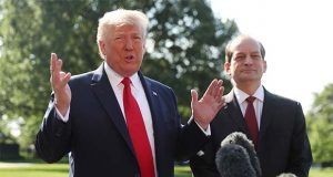 President Donald Trump speaks to members of the media with Secretary of Labor Alex Acosta on the South Lawn of the White House, Friday, July 12, 2019, before Trump boards Marine One for a short trip to Andrews Air Force Base, Md. and then on to Wisconsin. (AP Photo/Andrew Harnik)