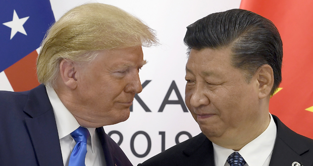 FILE - In this June 29, 2019, file photo, President Donald Trump, left, meets with Chinese President Xi Jinping during a meeting on the sidelines of the G-20 summit in Osaka, Japan. China has announced it will raise tariffs on $75 billion of U.S. products in retaliation for President Donald Trump's planned Sept. 1 duty increase in a war over trade and technology policy. (AP Photo/Susan Walsh, File)