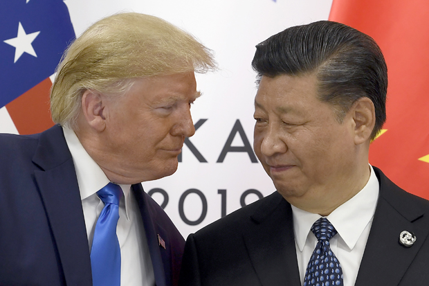 In this June 29 file photo, President Donald Trump meets with Chinese President Xi Jinping during a meeting on the sidelines of the G-20 summit in Osaka, Japan. China announced Friday it will raise tariffs on $75 billion of U.S. products in retaliation for President Donald Trump's planned Sept. 1 duty increase in a war over trade and technology policy.