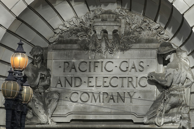 In this photo taken Oct. 10, a Pacific Gas & Electric sign is shown outside of a PG&E building in San Francisco. A federal bankruptcy court judge Wednesday rejected Pacific Gas & Electric's latest attempt to change a California law requiring utilities to pay for the devastation from wildfires ignited by their electrical equipment. The decision issued by U.S. Bankruptcy Judge Dennis Montali preserves a long-standing principle known as "inverse condemnation." (AP Photo/Jeff Chiu)