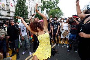 Demonstrator dance as they protest Saturday, June 6, 2020, near the White House in Washington, over the death of George Floyd, a black man who was in police custody in Minneapolis. Floyd died after being restrained by Minneapolis police officers. (AP Photo/Jacquelyn Martin)