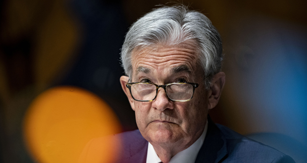 FILE - In this Dec. 1, 2020 file photo, Federal Reserve Chair Jerome Powell listens during a Senate Banking Committee hearing on Capitol Hill in Washington. Federal Reserve officials were convinced last month that the U.S. economy and job growth had slowed as coronavirus cases surged across the country. They noted that the economy's outlook is heavily dependent on the course of the virus. (Al Drago/The New York Times via AP, Pool)