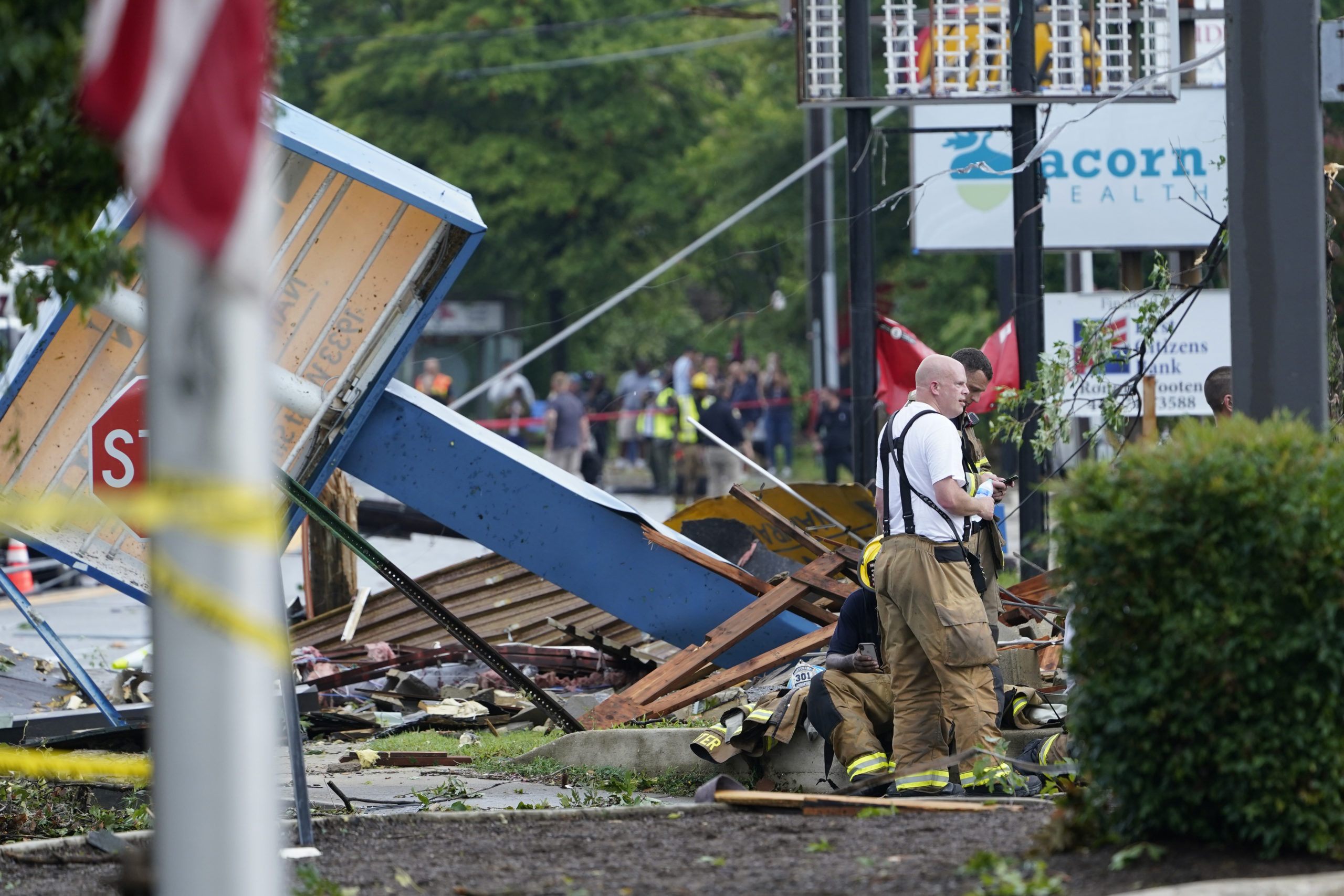 Debris is strewn along West Street in Annapolis on Sept. 1, 2021, after severe weather moved through the area. (AP Photo/Susan Walsh)