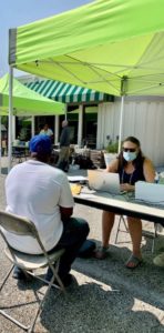 Volunteer attorney Kim Wagner helps a 45-year-old Baltimore man determine if he's eligible for criminal records expungement at a clinic hosted by Maryland Legal Aid and Loyola University Maryland. (Sapna Bansil/Capital News Service)