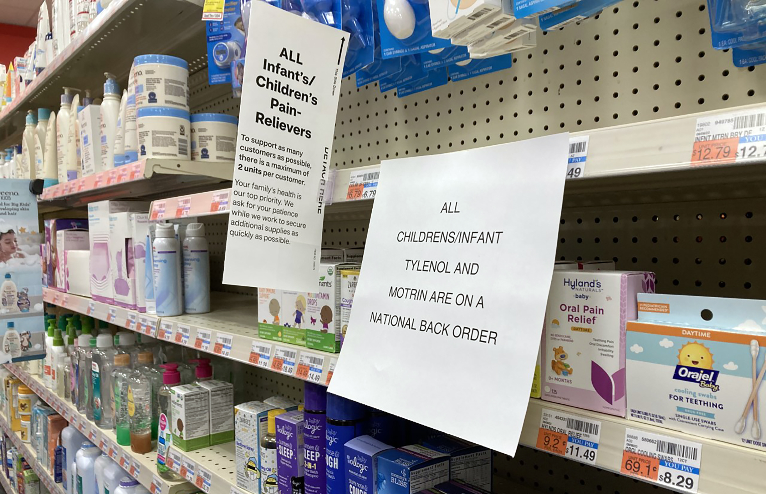 A sign is placed near the section for children's medicine on Dec. 18, 2022 at a CVS in Greenlawn, New York. Caring for a sick child has become even more stressful than usual for many U.S. parents in recent weeks due to shortages of Children’s Tylenol and other medicines. (AP Photo/Leon Keith)
