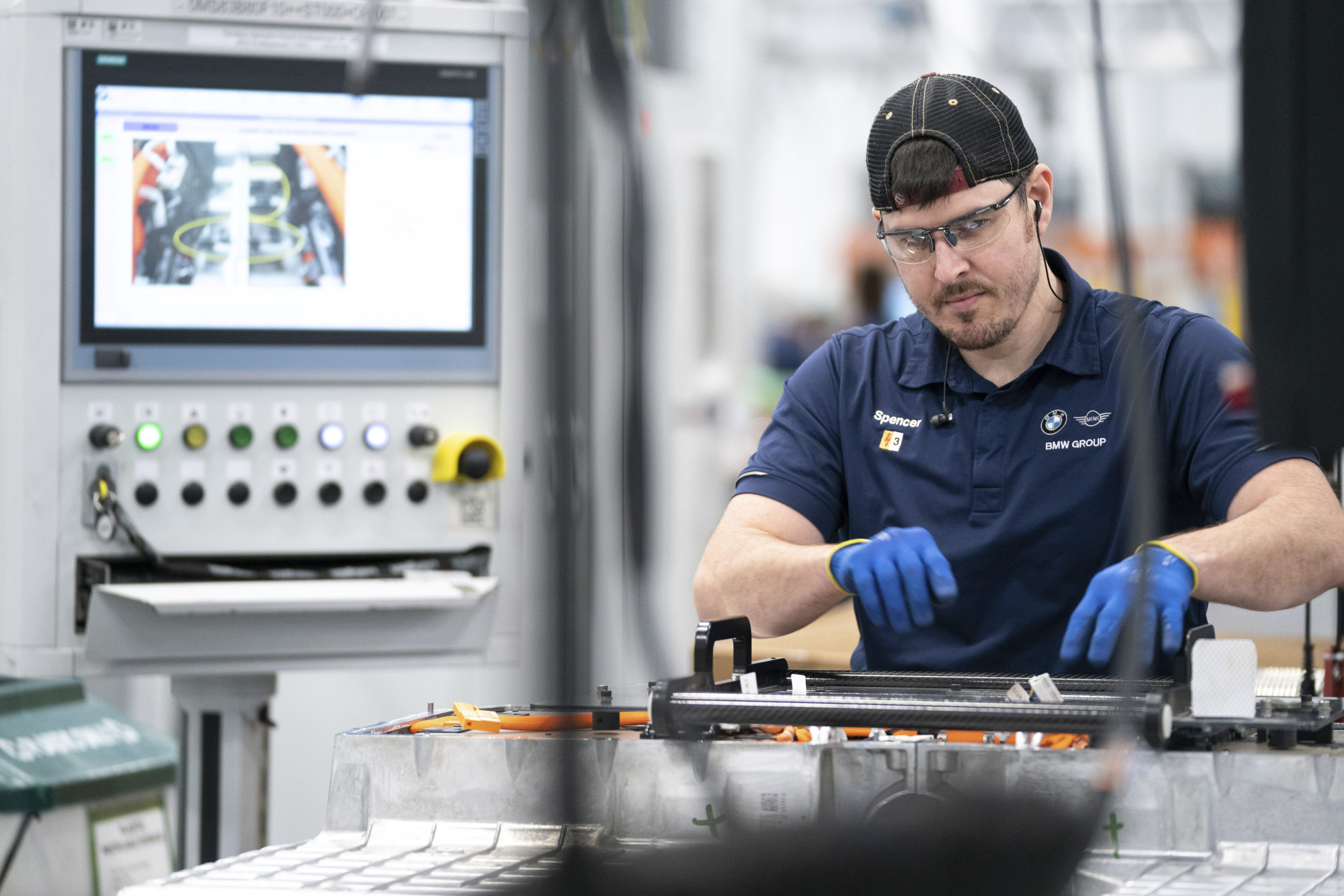 An employee works in the battery assembly hall at the BMW Spartanburg plant in Greer, South Carolina, on October 19, 2022. (AP Photo/Sean Rayford, File)
