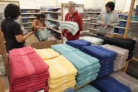 Employees arrange a display at a Kohl's store in Clifton, New Jersey, on Jan. 26, 2024. (AP Photo/Seth Wenig, File)