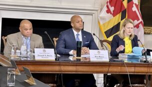 From left, State Treasurer Dereck Davis, Gov. Wes Moore and Comptroller Brooke Lierman listen to a speaker at a meeting of the Board of Public Works on March 13, 2024. (Sapna Bansil/Capital News Service)