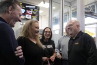 Former Maryland Gov. Larry Hogan, right, talks with patrons of DePaola's Bagel and Brunch in Stevensville on April 12, 2024, as he campaigns for the U.S. Senate. (AP Photo/Susan Walsh)