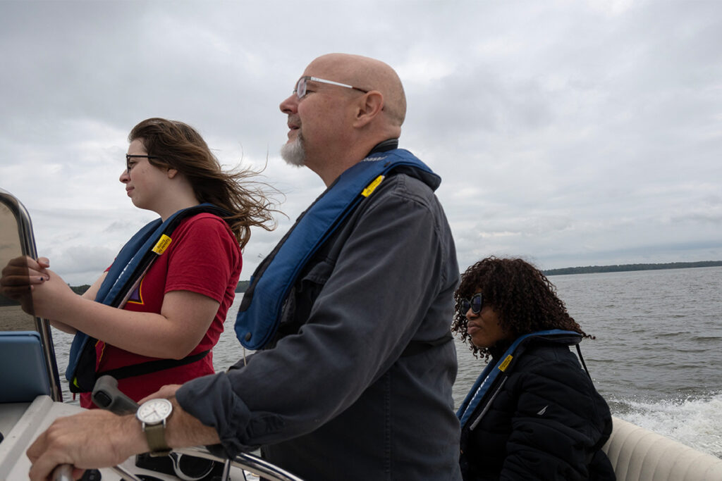 Researchers on the Gunpowder River studying the loss of underwater vegetation