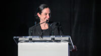 Sarah David, the 2025 Top Leader in Law honoree, announces the 2026 Top Leader in Law winner during The Daily Record's Leaders in Law event April 20, 2026. (Steve Ruark/The Daily Record)