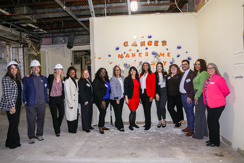 From left, Dara Heidt, Bill Ethier, Jamie McCann, Samanthan Bala-Ndimal, Aimee Anderson, Lisa Baynes, Rosa Villoch-Santiago, Keely Couillard, Tswana Sewell, Maggie Hughes, Leah Malakoff, Jake Fratangelo, Tunisia Hollingsworth and Karen Wolcott. (Photo by Annalise Dietz)
