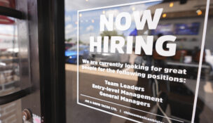 A sign announces a restaurant is hiring workers July 15, 2025, in Richardson, Texas. (AP Photo/LM Otero)
