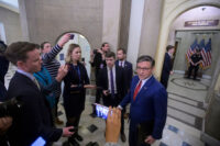 Speaker of the House Mike Johnson, R-La., talks with reporters outside his office at the U.S. Capitol in Washington on Nov. 12, 2025. (AP Photo/Rod Lamkey, Jr.)