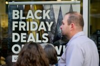A general view of a sign highlighting discounted items as Black Friday sales begin at The Outlet Shoppes of the Bluegrass in Simpsonville, Kentucky, on Nov. 26, 2021. (Reuters file/Jon Cherry)