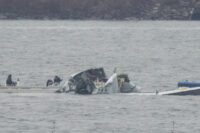 Search and rescue teams work near Ronald Reagan Washington National Airport in the aftermath of the collision of American Eagle flight 5342 and a U.S. Army Black Hawk helicopter that crashed into the Potomac River, outside Washington, U.S., January 31, 2025. (REUTERS/Jeenah Moon)
