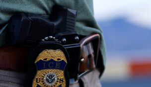 The badge of a U.S. Immigration and Customs Enforcement (ICE) agent is seen at the airport in El Paso, Texas, on May 10, 2023. (USA TODAY Network)