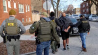 U.S. Immigration and Customs Enforcement agents conduct an arrest as part of President Donald Trump's wide-ranging immigration crackdown in Chicago in a still image from video. (Immigration and Customs Enforcement/Handout via REUTERS)