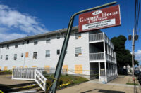 Boards cover the windows of the Gabriel House assisted living facility, where a fire killed multiple people, July 15, 2025, in Fall River, Mass. (AP File Photo/Kimberlee Kruesi)