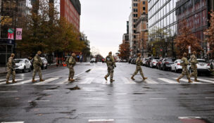 Members of the National Guard cross the street near the site of a shooting of two National Guard members in Washington, D.C., November 30, 2025. (REUTERS/Annabelle Gordon)