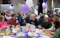 Attendees at the Whiting-Turner sponsorship table during the Stella Maris Crab Feast on Saturday, October 11, 2025, at the Maryland State Fairgrounds in Timonium. (Greg Dohler)