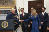 President Donald Trump greets Susan Dell on Dec. 2 at the White House after saying that she and her husband Michael Dell had pledged $6.25 billion for Trump Accounts. (Carolyn Van Houten/The Washington Post)