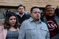 Kilmar Abrego Garcia, the migrant whose wrongful deportation to El Salvador made him a symbol of U.S. President Donald Trump's aggressive immigration policies, walks with his wife Jennifer Vasquez Sura outside U.S. District Court on the day of a hearing in his case, in Greenbelt on Dec. 22, 2025. (REUTERS/Evelyn Hockstein)