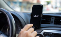 The Uber app being used in a car (DEPOSITPHOTOS)