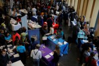 Job seekers speak with potential employers at a City of Boston Neighborhood Career Fair on May Day in Boston on May 1, 2017. (REUTERS/Brian Snyder)