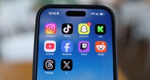 Instagram, TikTok, Snapchat, Kick, YouTube, Facebook, Twitch, Reddit, Threads and X applications are displayed on a mobile phone in this picture illustration taken on Dec. 9, 2025. (REUTERS/Hollie Adams/Illustration//File Photo)