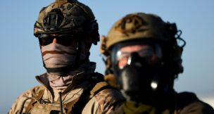 U.S. federal agents look on as they stand guard in Camarillo, California, on July 10, 2025. (REUTERS/Daniel Cole/File Photo)