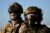 U.S. federal agents look on as they stand guard in Camarillo, California, on July 10, 2025. (REUTERS/Daniel Cole/File Photo)