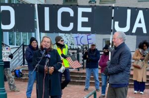 Sen. Chris Van Hollen watches as Congresswoman April McClain Delaney addresses the crowd at a Jan. 20, 2026, rally in downtown Hagerstown against a proposed immigrant detention center in Washington County. (USA TODAY Network via Reuters Connect)