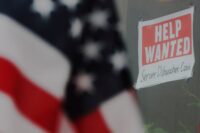 A “Help Wanted” sign hangs in restaurant window in Medford, Massachusetts, on Jan. 25, 2023. (REUTERS/Brian Snyder)