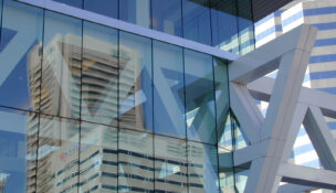 Reflections of WTC and Bank of America buildings in the glass of the Convention Center. MF-D 12-4-00