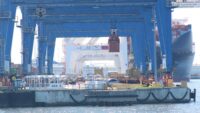 A crane lifts a shipping container at the Port of Baltimore's Seagirt Marine Terminal on May 12, 2026.