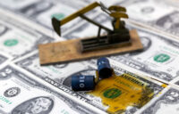 Oil, miniatures of oil barrels, oil pump jack and U.S. dollar banknote are seen in this illustration taken, June 6, 2023. (REUTERS file illustration/Dado Ruvic)