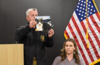 Sheriff Mike Lewis holds a photo taken during a large-scale animal cruelty investigation at a news conference March 2, 2026, at the Wicomico County Sheriff's Office in Salisbury. (USA TODAY Network via Reuters Connect)