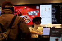 A menu bearing the logo of BTS THE CITY ARIRANG SEOUL on display at a cafe in Seoul on March 23, 2026. (REUTERS/Daewoung Kim)