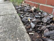 Cigarette butts are seen outside of Peabody Heights Brewery in Baltimore. (Ian Round/The Daily Record)