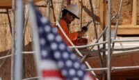 A construction worker is shown at work on a multi-unit residential housing project in Encinitas, California, on July 28, 2025. (REUTERS/Mike Blake)