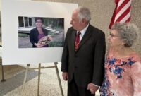 Alan and Barbara Marcum look at a photo of Alan's sister, Sue Marcum, after Jorge Landeros's sentencing this month. (The Washington Post News Service)