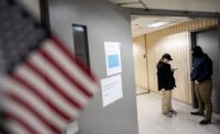 FILE PHOTO: Federal immigration officers wait for respondents in a hallway to conduct targeted detainments at U.S. immigration court in Manhattan, New York, on Jan. 14, 2026. (REUTERS/David 'Dee' Delgado/File Photo)